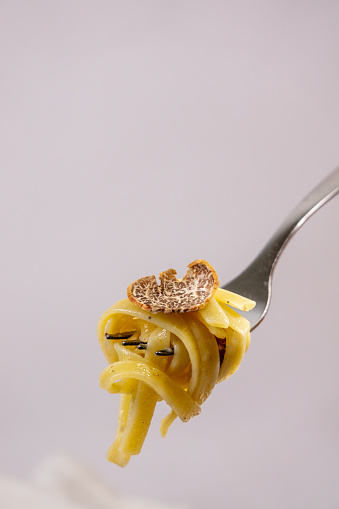 Close up of a fork with truffle tagliatelle