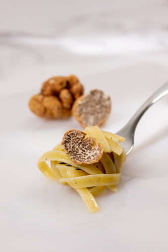 Close up of a fork with truffle tagliatelle