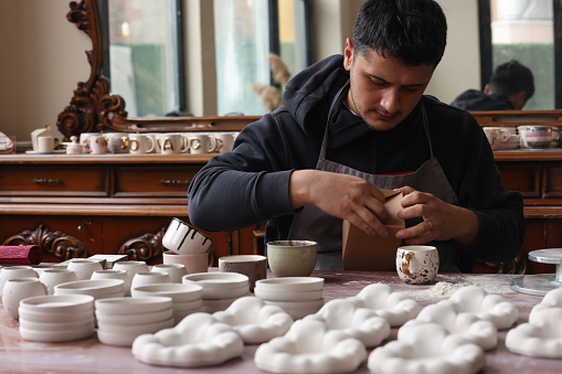 Ceramic artist makes coffee cups