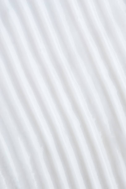 istock Smears of white cream on a beige background, cream texture 1463826766