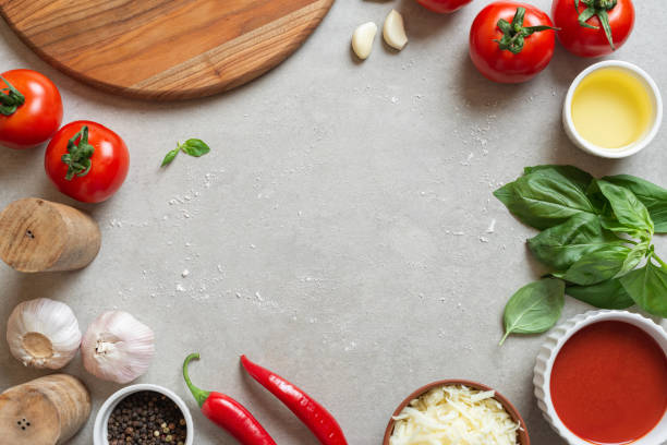istock The process of making margarita pizza. Male hands, top view. Tomato paste with cheese. 1463827175