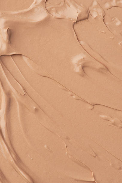 istock The texture of the foundation on a beige background 1463827220