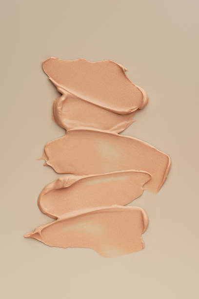 istock The texture of the foundation on a beige background 1463827329