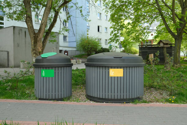 istock Two round garbage cans for sorting garbage stand on the street 1463827432