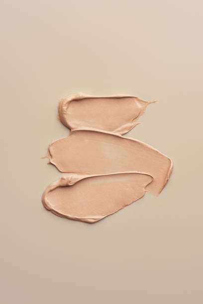 istock The texture of the foundation on a beige background 1463827476