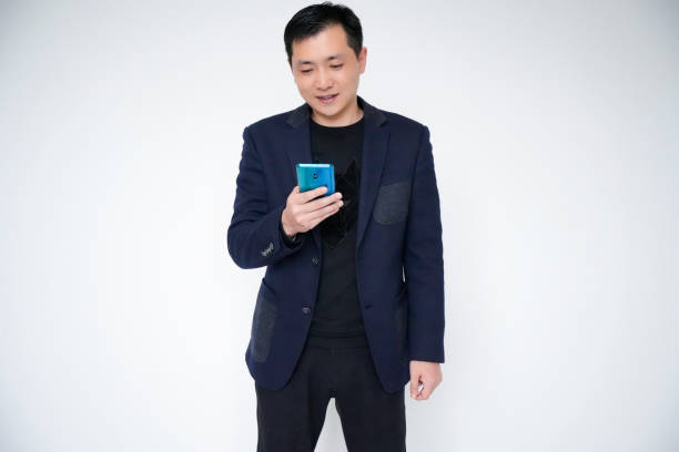 istock Portrait of businessman, white collar, office worker using mobile phone 1463827500