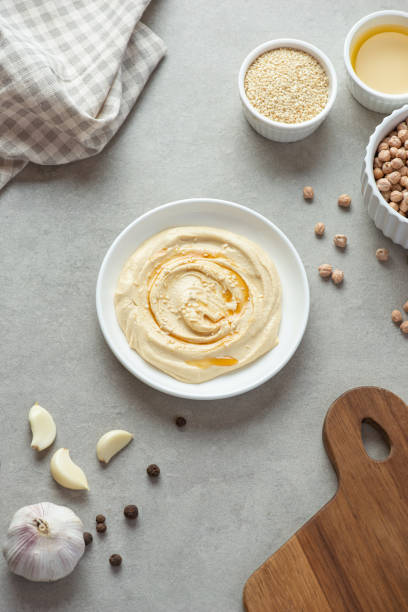 istock Cooking hummus from chickpeas on the table. curly background. Veganism. 1463827723