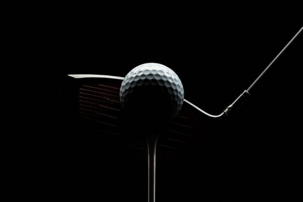 istock Stealth Driver Head and Golf Ball on Black Background 1463828952