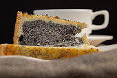 a cut piece of cake with poppy seed filling