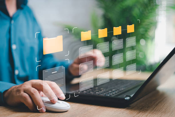 istock Business data management online and document system concept, Businessman use laptop search for digital documents in folders efficient storage management good planning 1463830163