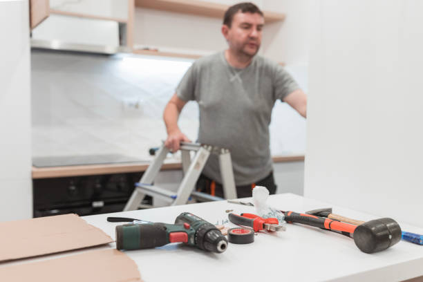 Handyman having tool scattered on a table stock photo
