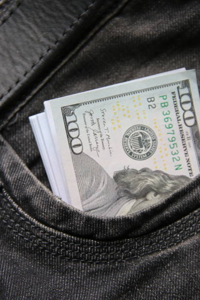 istock American dollars USD banknotes in jeans pocket. 1463830885