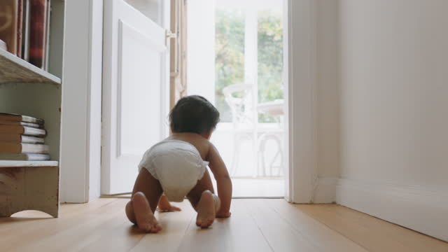 baby girl crawling on floor toddler exploring home curious infant having fun enjoying childhood