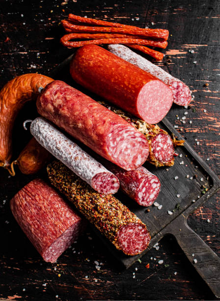 istock Different types of salami sausage on a cutting board. 1463831639