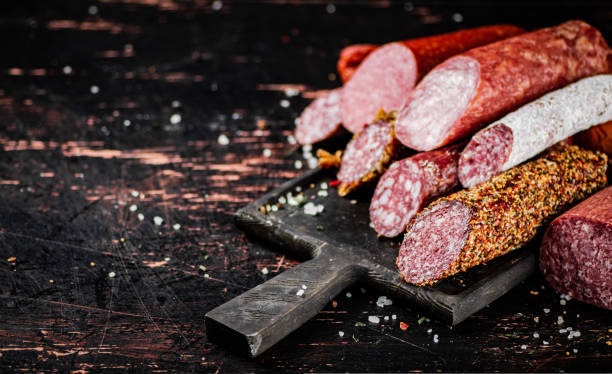 istock Different types of salami sausage on a cutting board. 1463831747