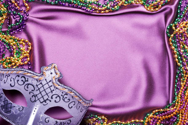 istock Mardi Gras Mask And Beads On Purple Satin Background 1463833027