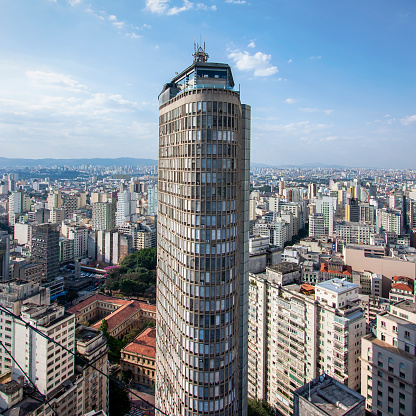São Paulo, São Paulo, Brazil – August, 6, 2015: Circolo Italiano building facade with São Paulo’s skycrapers and skyline visible. Emphasis at Italia’s building at the Center of the frame.