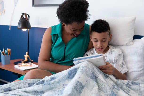 istock Doting mother and son study together in the room at home 1463833994
