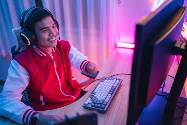 istock A disabled gamer is streaming matches and chatting with viewers on his stream. 1463834198