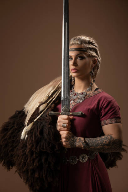 istock Weapon wielding blonde viking warrior queen in studio shot 1463834877