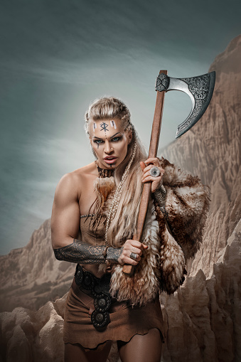 Beautiful Blonde Warrior Woman on a mountain side