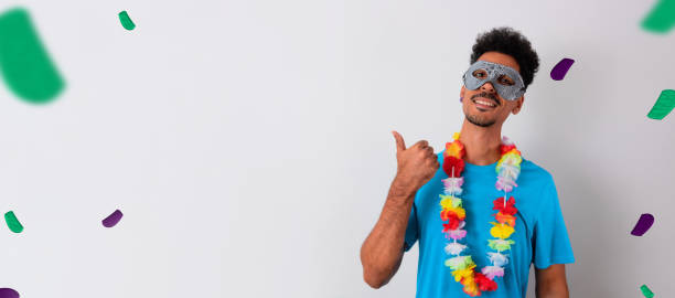 istock Black Man With Carnival Costume Pointing Isolated on White. 1463835663