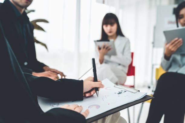 istock Business people proficiently discuss work project while sitting in circle . Corporate business team collaboration concept . 1463836713