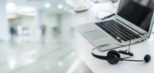 istock Headset and customer support equipment at call center ready for actively service . Corporate business help desk and telephone assistance concept . 1463837220