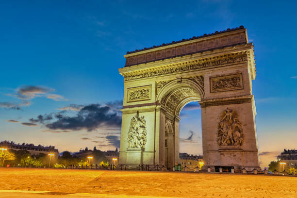 Paris France city skyline night at Arc de Triomphe and Champs Elysees stock photo