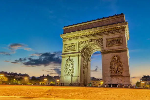 Paris France city skyline night at Arc de Triomphe and Champs Elysees