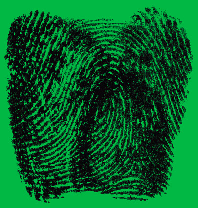 Black ink fingerprint on green background. Real fingerprint.