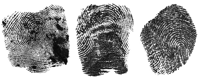 Collection of black fingerprints made with ink, isolated on a white background. Human fingerprint.