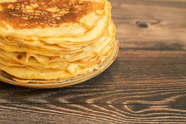 istock Delicious pancakes with chocolate sauce fresh blueberries on a rustic wooden table. Rustic brown table. 1463846728