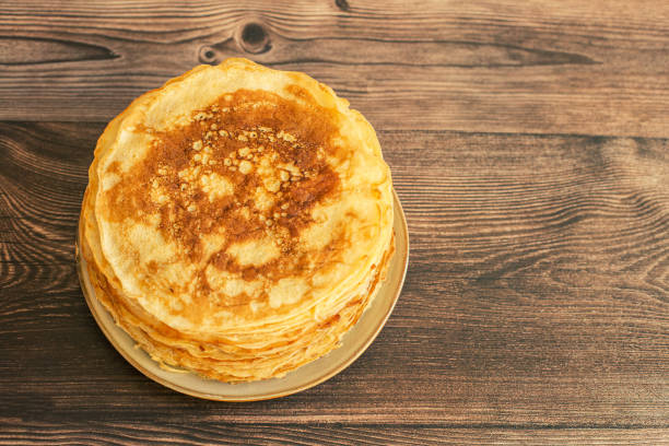 istock Delicious pancakes with chocolate sauce fresh blueberries on a rustic wooden table. Rustic brown table. 1463846890