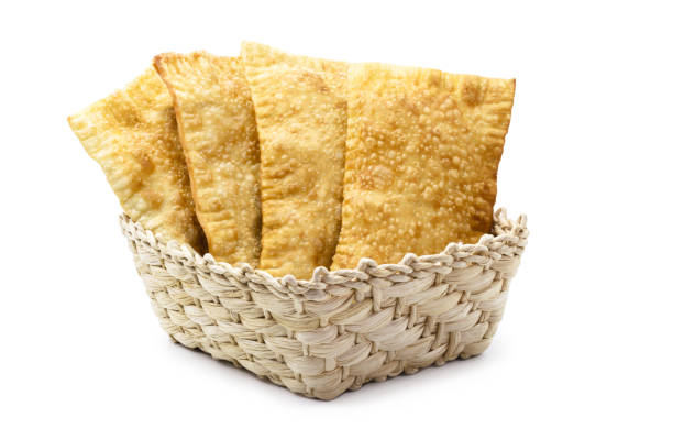 istock Brazilian pastry, typical fried salty stuffed with ground beef, sauce and pepper, typical brazilian salt, served in bakeries, bars and restaurants, isolated white background, copy space 1463848826