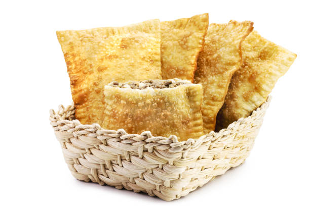 istock Brazilian pastry, typical fried salty stuffed with ground beef, sauce and pepper, typical brazilian salt, served in bakeries, bars and restaurants, isolated white background, copy space 1463848849