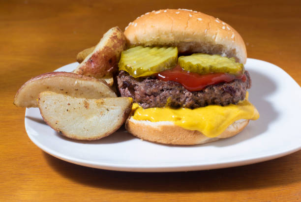 istock hamburger top with  pickles  served on a sesame bun 1463860012