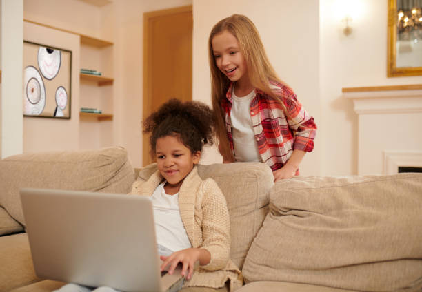 istock Two girls spending time together and watching something on internt 1463863071