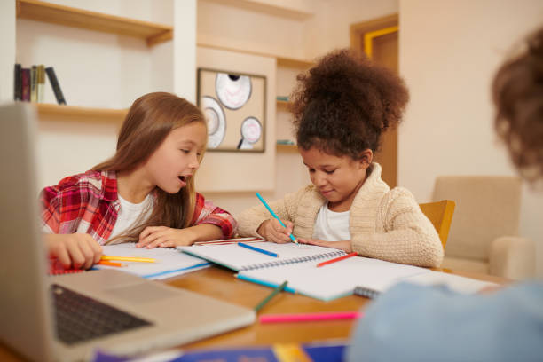 istock Schoolchildren preparing lessons together and discussing the tasks 1463863945