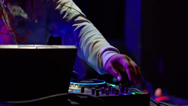 Slow Motion Reveal of DJ During Sound Check