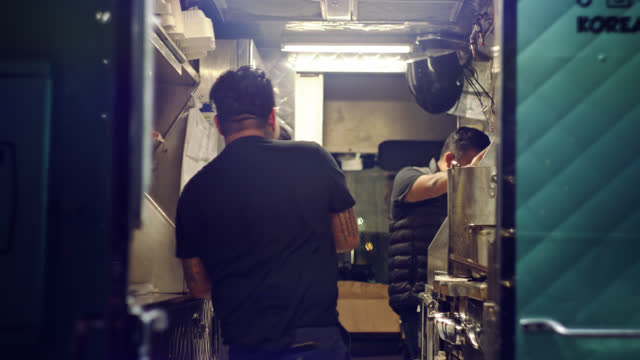Shot of Cooks in a Food Truck