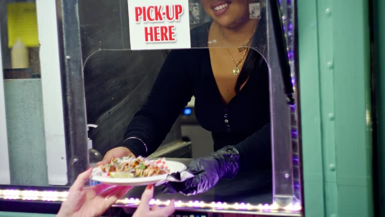 Handheld Close Up of Order Being Received at a Food Truck