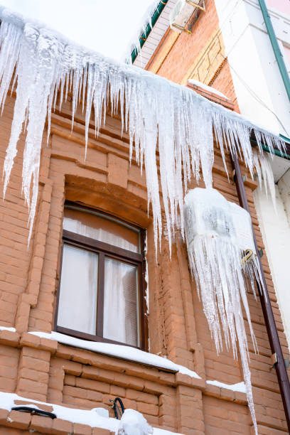 istock Close-up of icicles on the roof. 1463865872