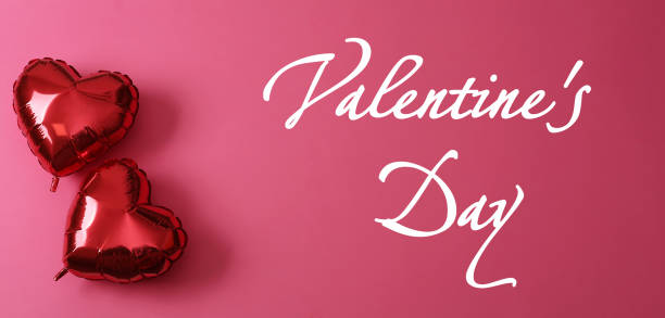 istock Happy Valentine's Day. Red heart shaped balloons on pink background, flat lay 1463868977