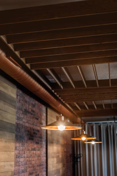 istock Lamps and chandeliers in the restaurant with warm light 1463869219