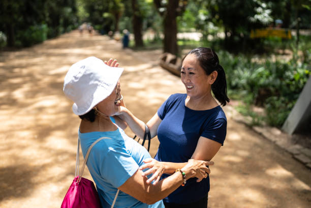 istock Mother and daughter talking on the public park 1463872843