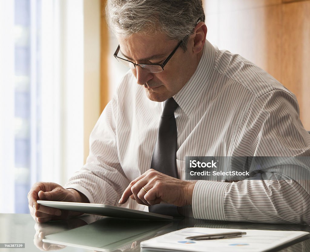 Businessman with electronic tablet  50-54 Years Stock Photo