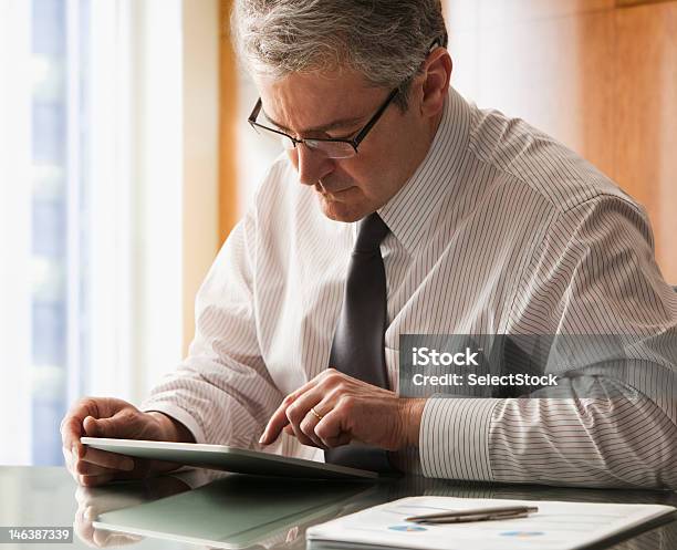 Businessman With Electronic Tablet Stock Photo - Download Image Now - 50-54 Years, Adult, Adults Only