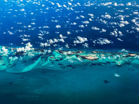 Islands and clouds seen from an airplane, Bahamas