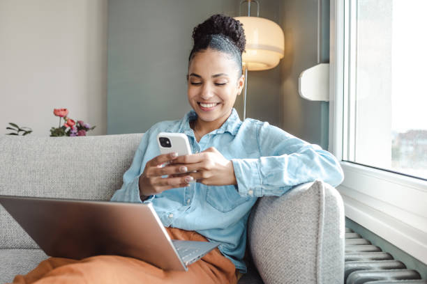 istock Beautiful woman working on a laptop and using smart phone 1463875065